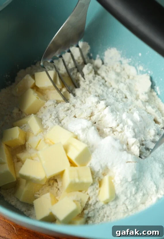 Cutting butter into dry ingredients for biscuits