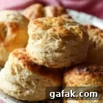 Air Fryer Biscuits stacked on a serving plate