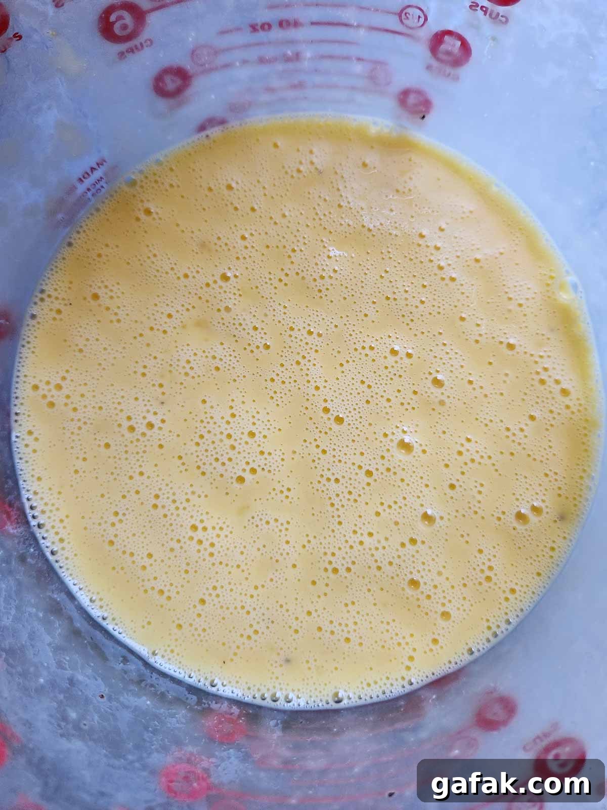Egg and buttermilk mixture in a bowl.