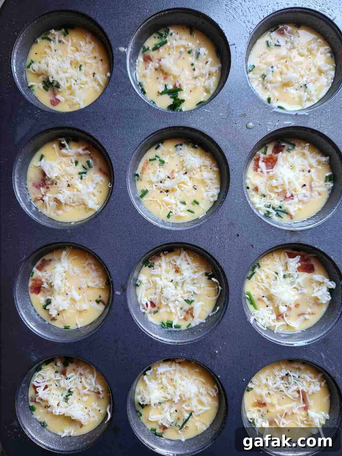 Egg bite batter in a muffin tin.