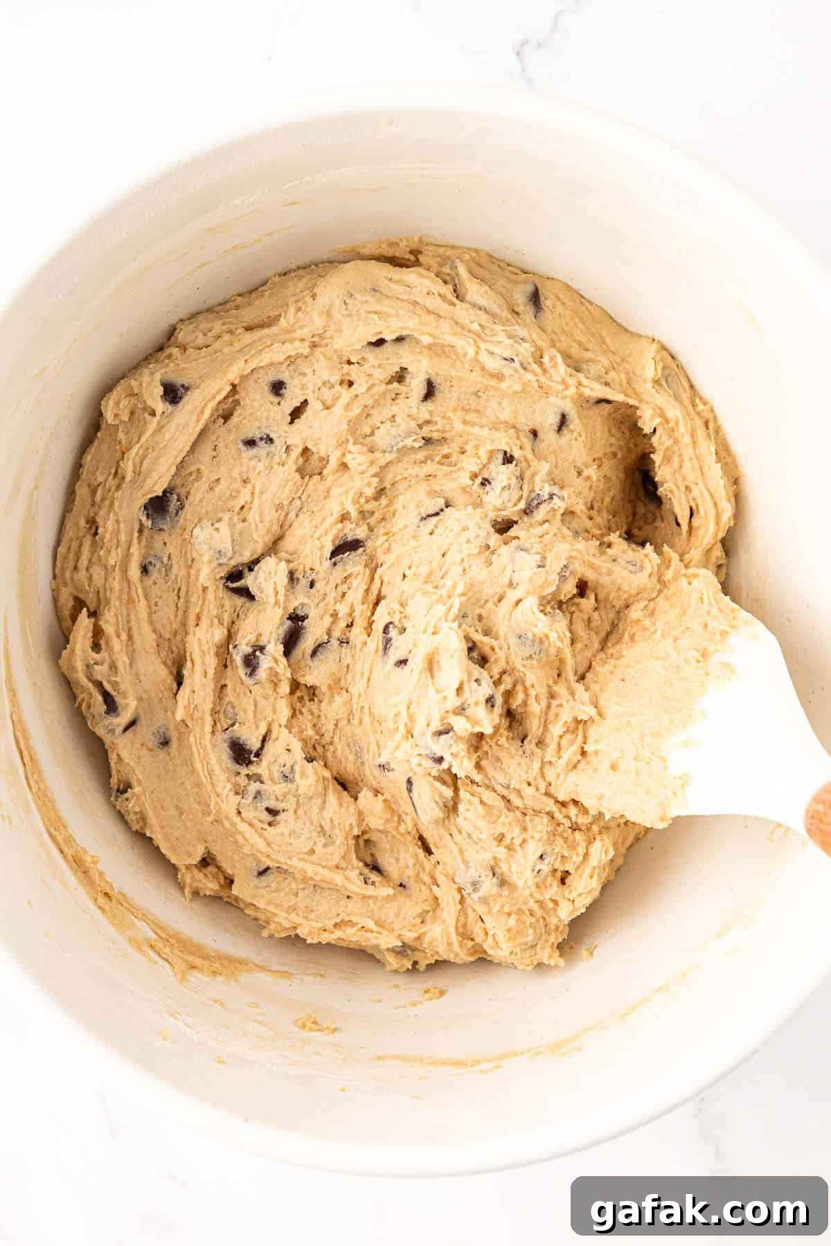 Vegan Chocolate Chip Cookie Recipe: Crispy Outside, Chewy Inside 12 folding the chocolate chips into the batter