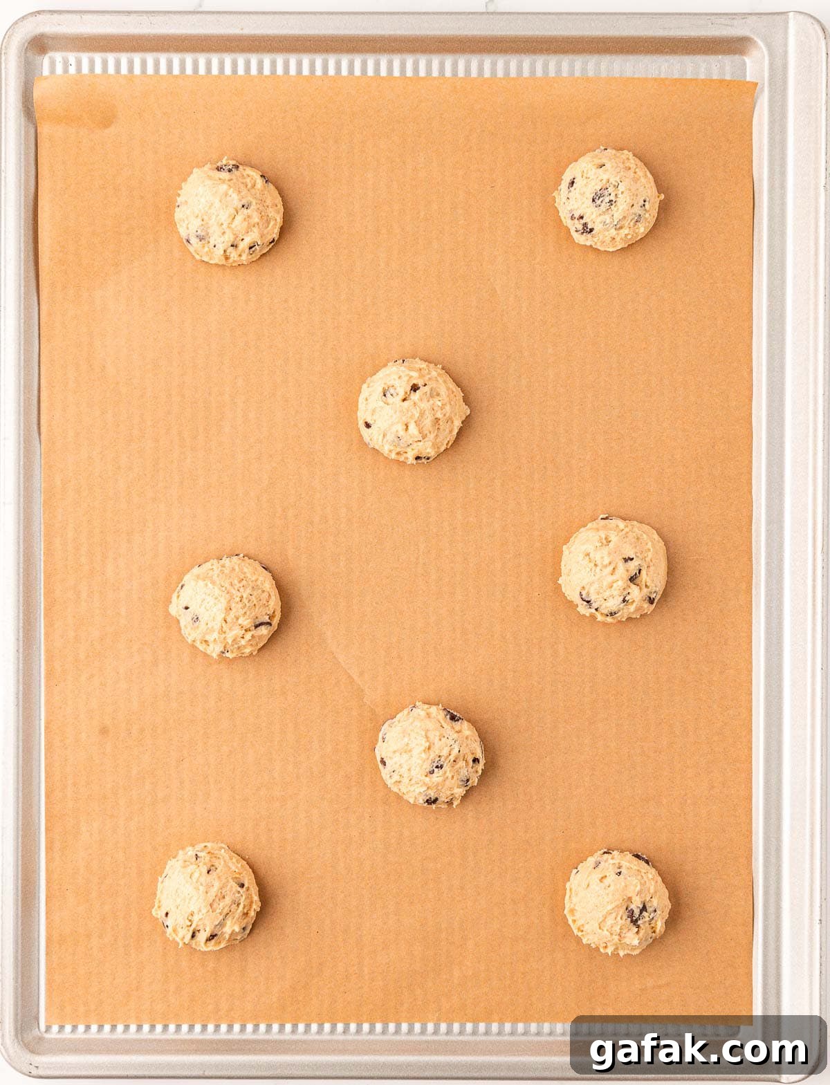Vegan Chocolate Chip Cookie Recipe: Crispy Outside, Chewy Inside 13 vegan chocolate chip cookie batter on a baking sheet