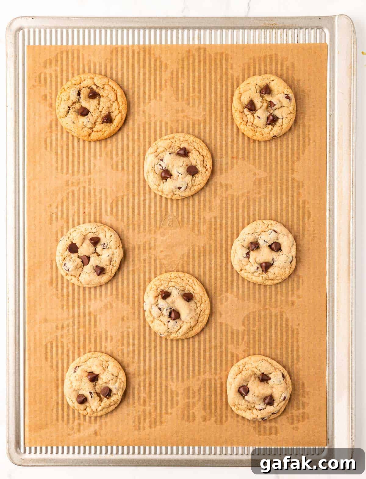 Vegan Chocolate Chip Cookie Recipe: Crispy Outside, Chewy Inside 14 vegan chocolate chip cookies on a baking sheet