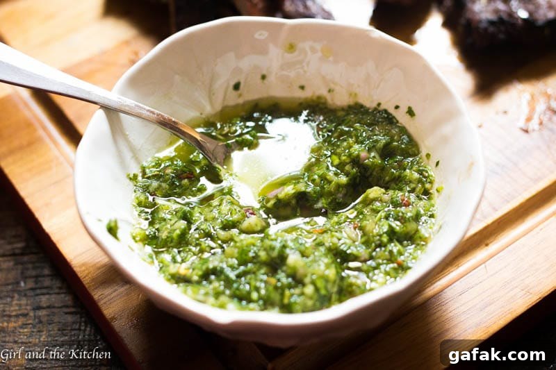My 5 minute chimichurri sauce has a secret ingredient that sets it apart from the rest! It comes together in just a few minutes with a couple of pulses in the food processor. This sauce packs loads of garlicky flavor and is a perfect sauce, marinade and dip for just about anything!