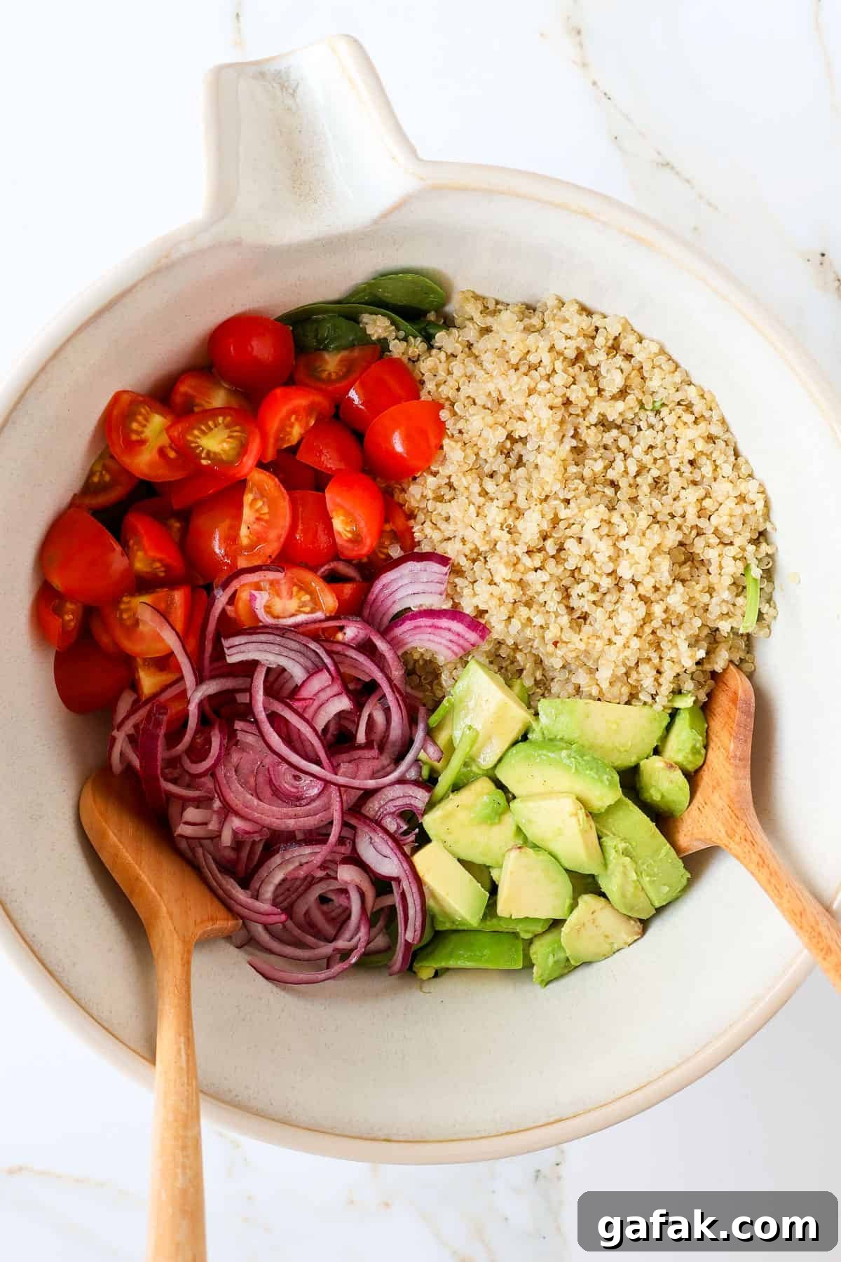 Salad ingredients in a mixing bowl.