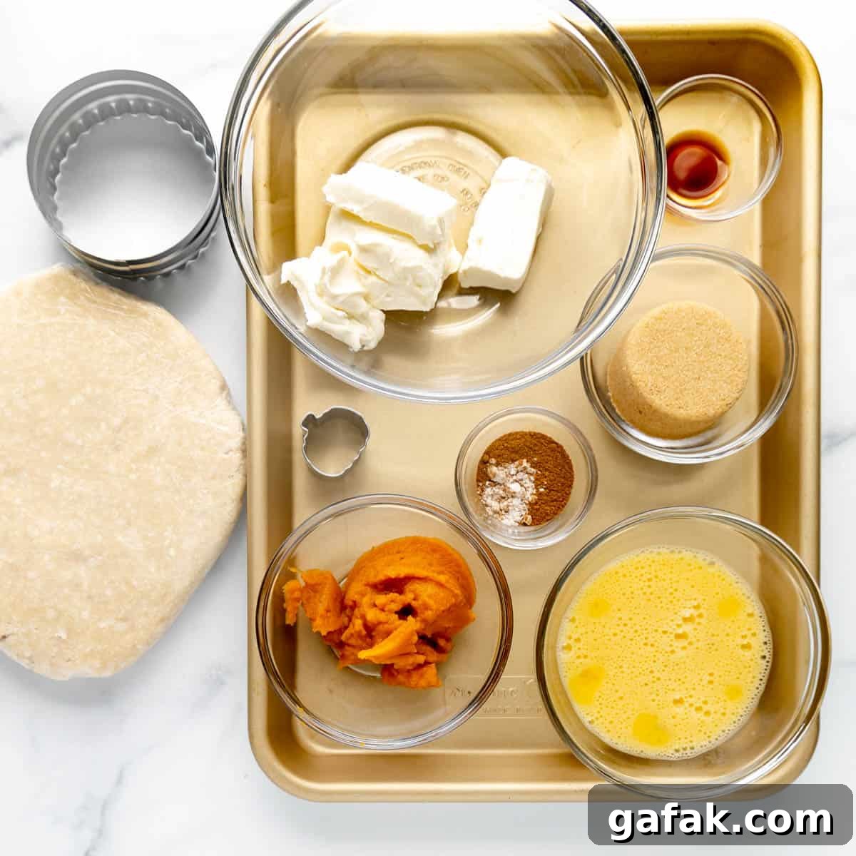 Mini Pumpkin Hand Pies: Flaky Autumn Pastry Recipe 3 Overhead image of Ingredients for pumpkin hand pies.