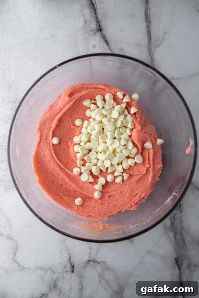 White chocolate chips added to strawberry brownie batter
