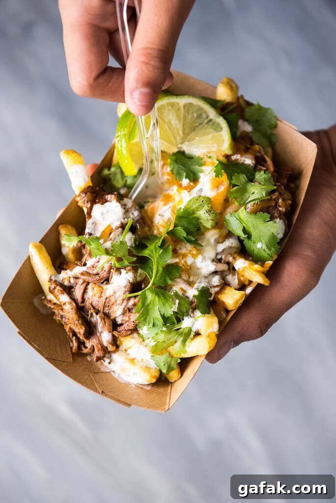 Slow Cooker Enchilada Chili Cheese Street Fries are a fun way to bring food truck style fair home! Makes great party food or a fun family dinner!
