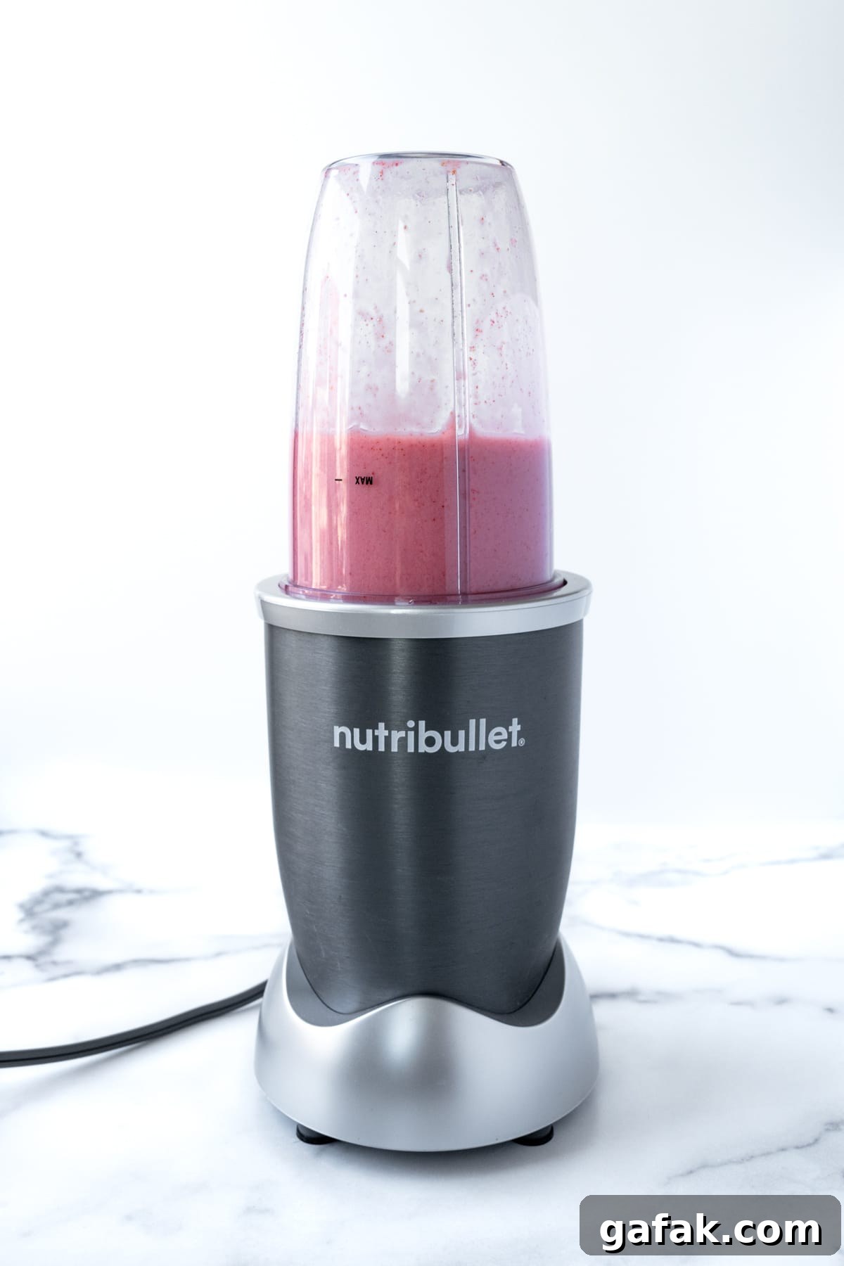 Almond Milk Strawberry Smoothie in a small blender.