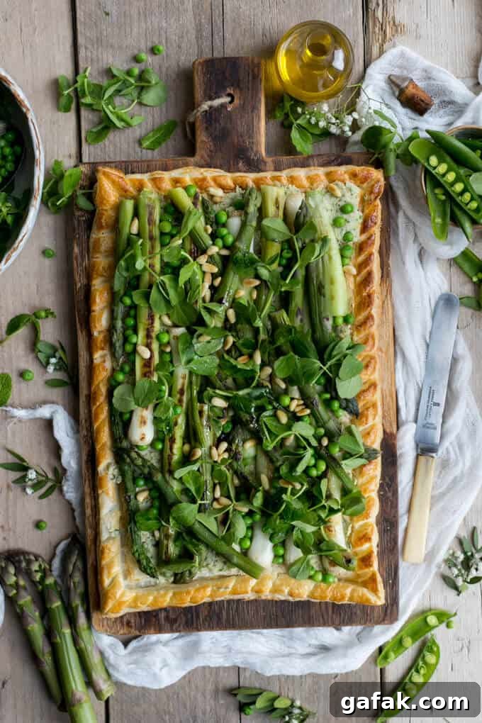 Charred asparagus tart with butter bean paste, pea shoots, baby leeks and pine nuts | via @annabanana.co 
