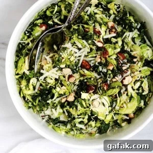 Kale and Brussels Sprouts Salad served in a white bowl