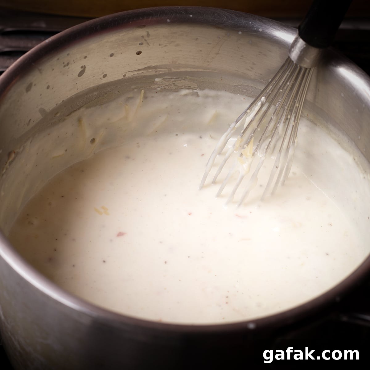 Creamy Mushroom Lasagna with Parmesan Béchamel Sauce 9 Whisking grated parmesan cheese into Béchamel sauce.