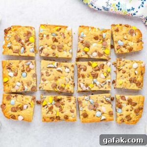 Overhead view of Cadbury Mini Egg Cookie Bars cut into squares.