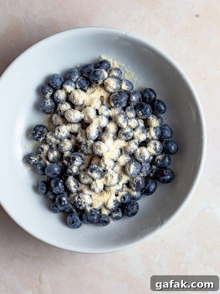Gluten-Free Blueberry Cake Recipe with Moist, Tender Crumb 4 a bowl of fresh berries with flour