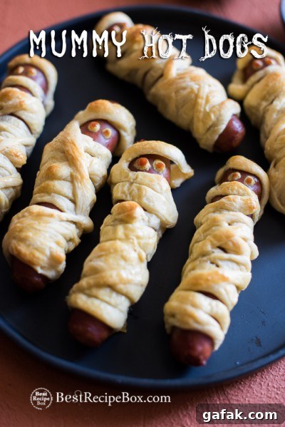 Halloween Mummy Hot Dogs Recipe on a plate 