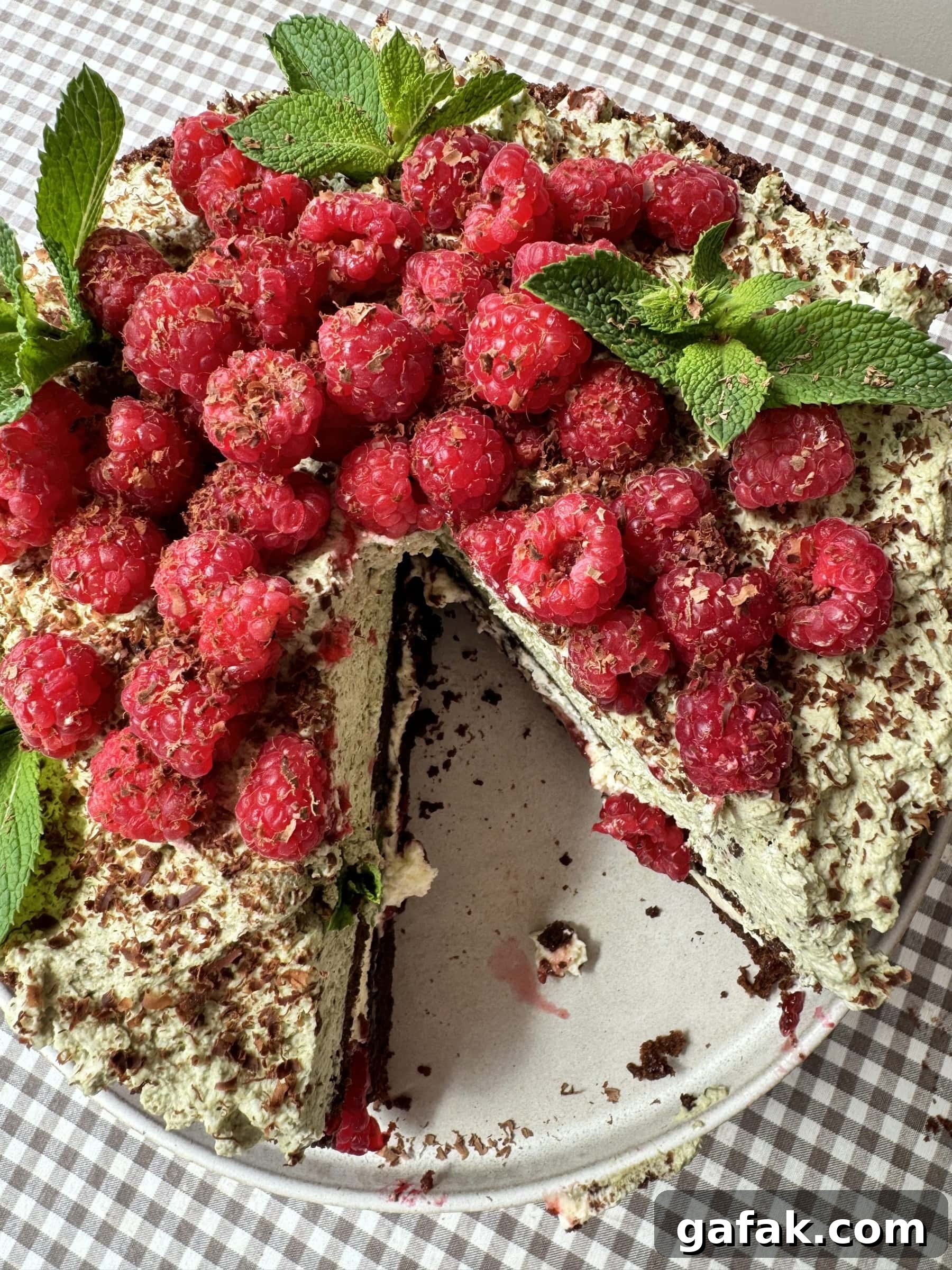 top down view of chocolate raspberry cake with slice out.