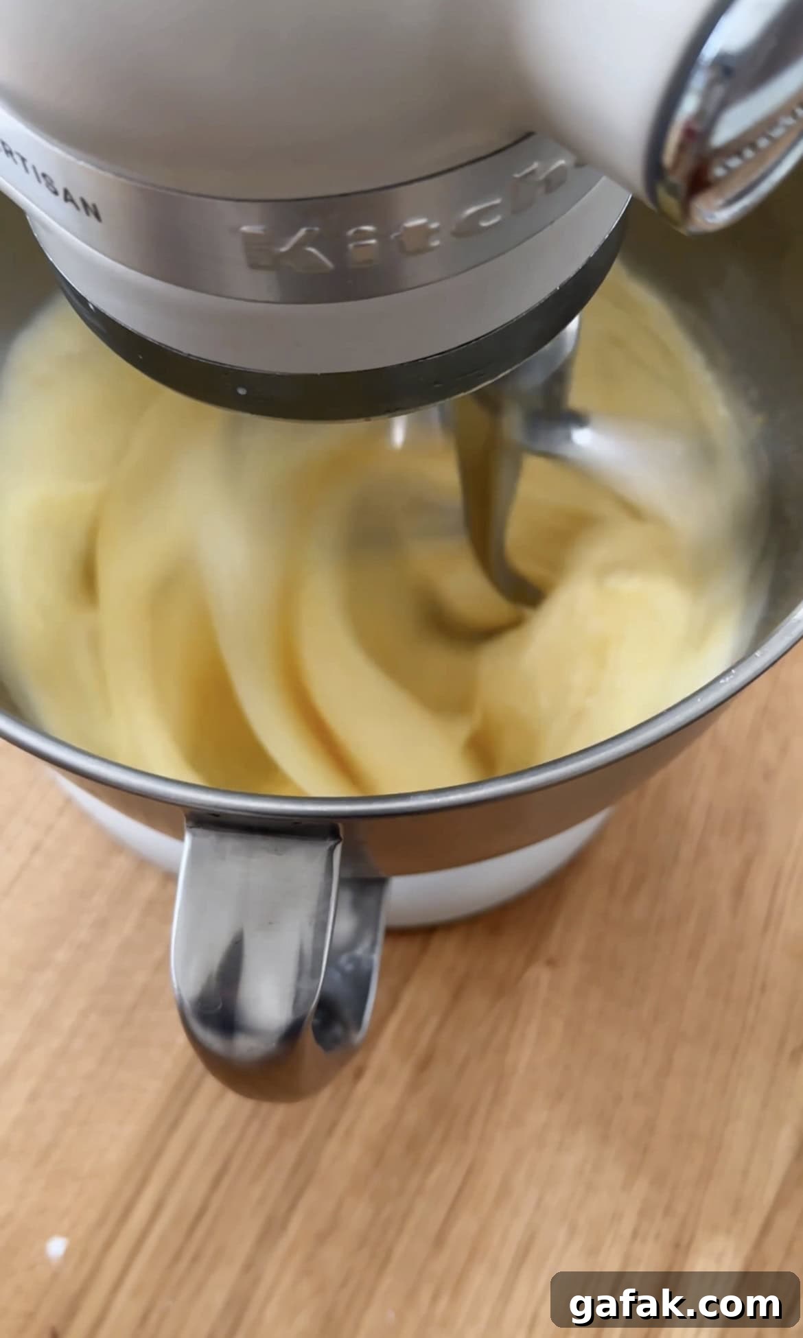 beating eggs and sugar.