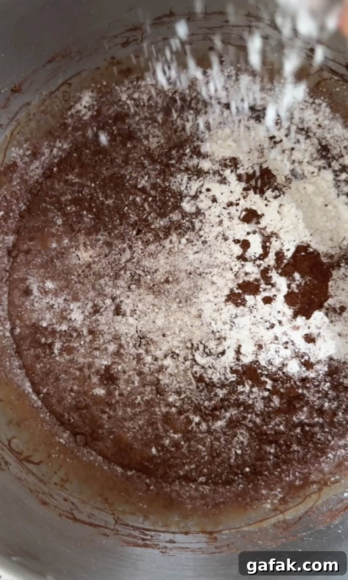 sifting flour into the batter.