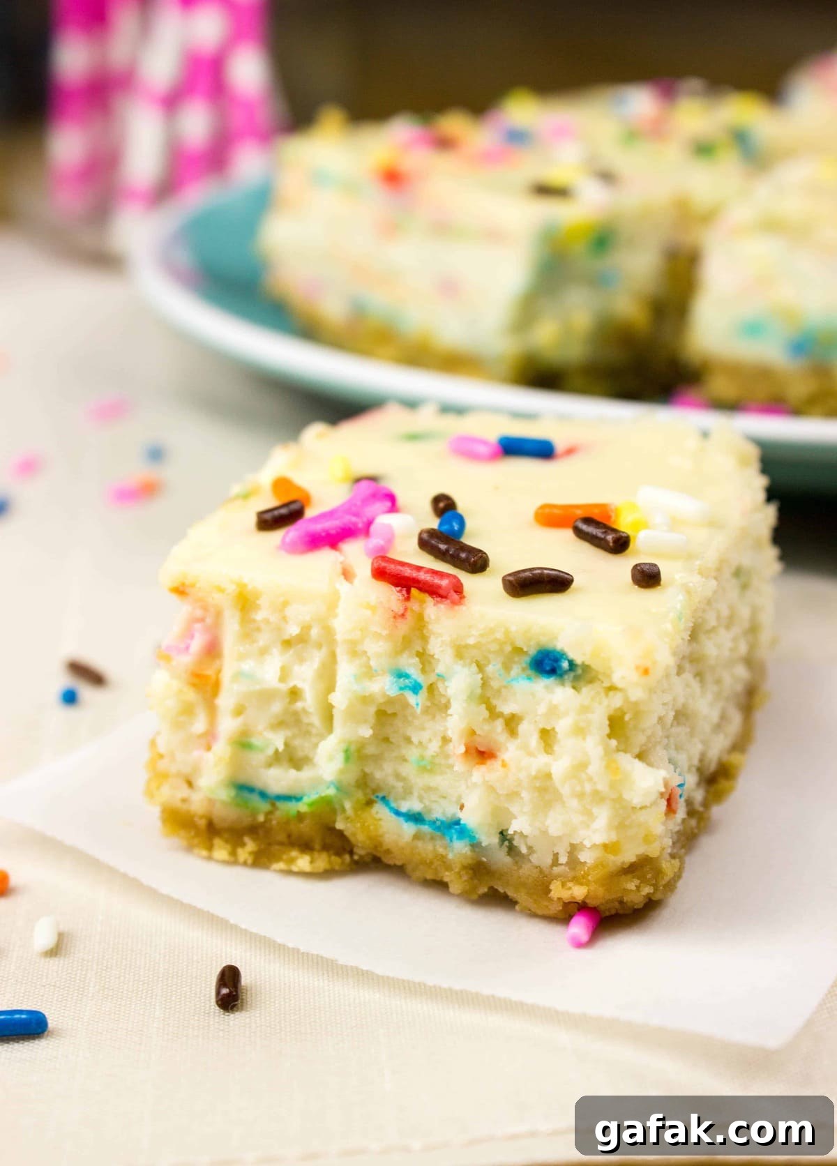 funfetti cheesecake square on white cloth
