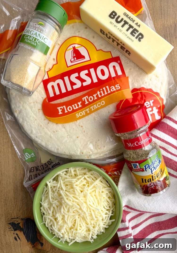 How to make garlic bread in your air fryer with flour tortillas, butter, shredded cheese, garlic powder, and Italian seasoning.