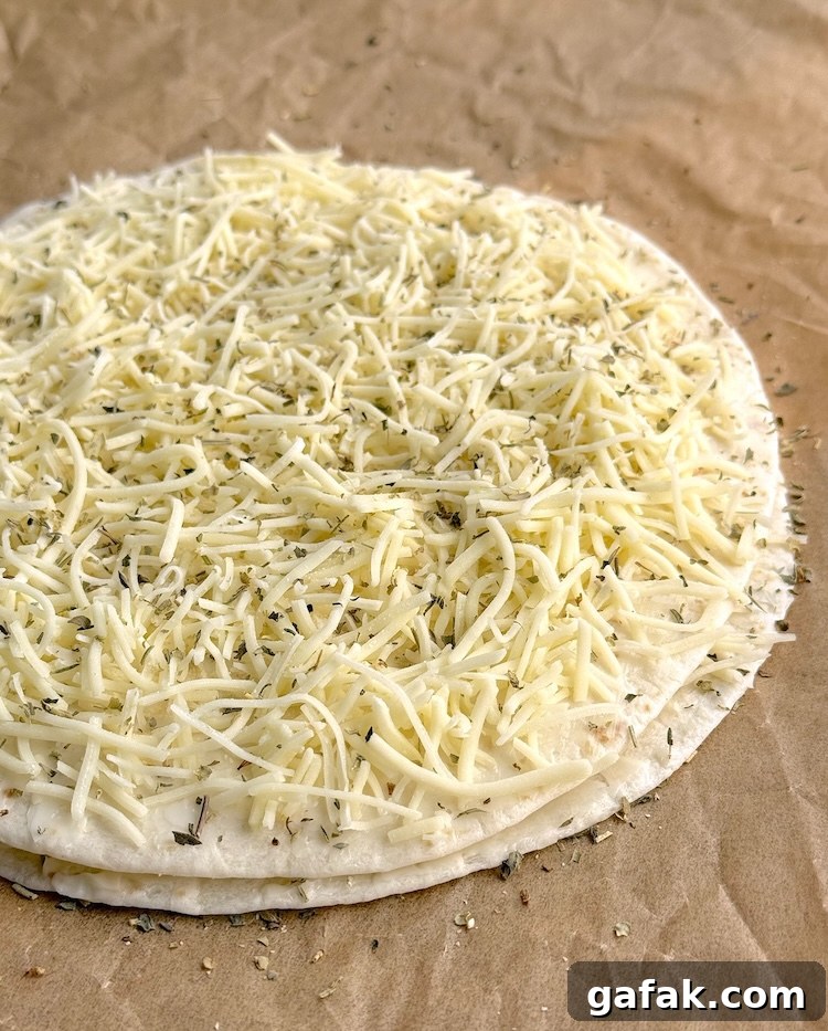Tortilla topped with cheese, garlic powder, and Italian seasoning.