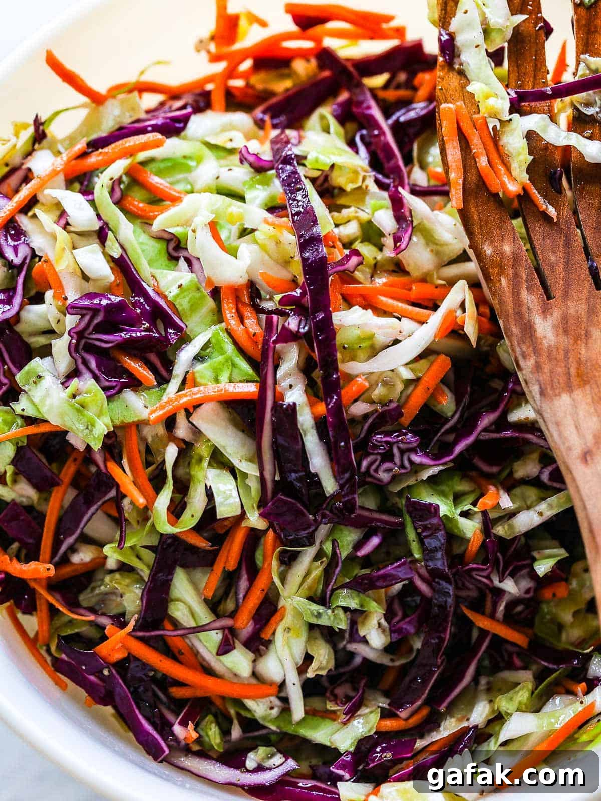 Tri-color coleslaw in a bowl.
