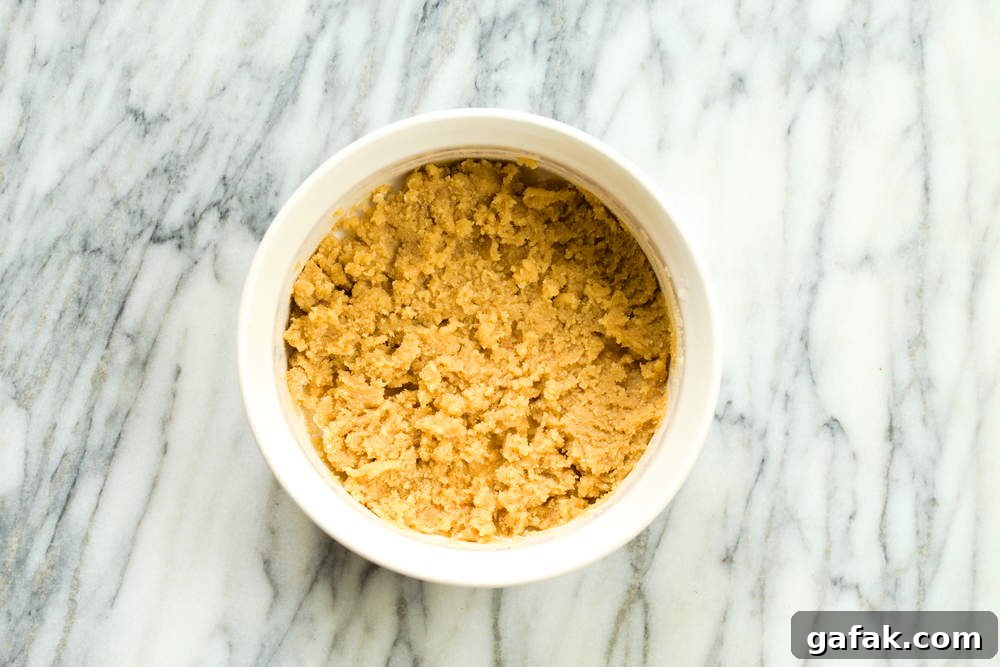 Almond Mixture for our Vegan Almond Halwa in a white baking dish